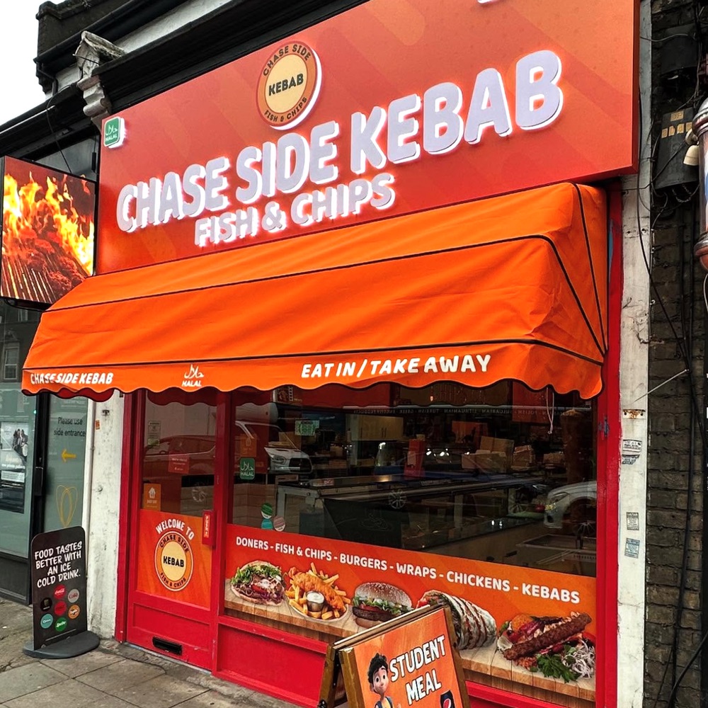 Chase Side Kebab shop front with illuminated sign and orange awning